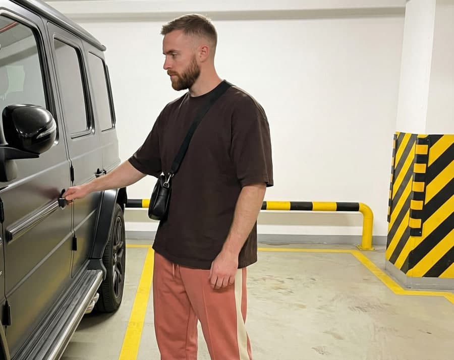 Ethan next to a G-Wagon